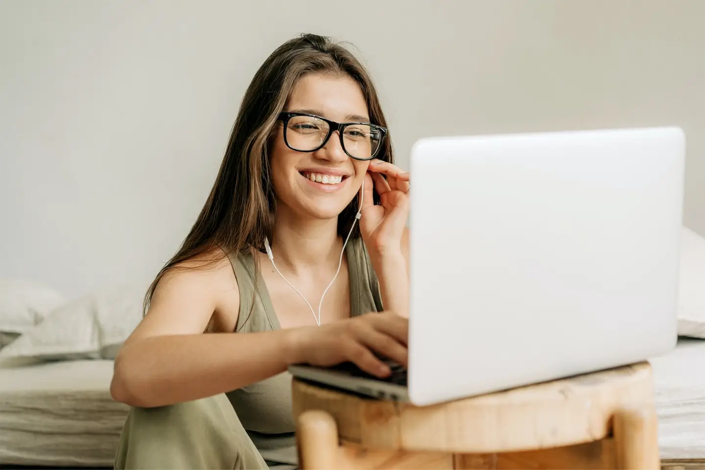 freelancer-woman-at-online-meeting-using-laptop-and-headphones-